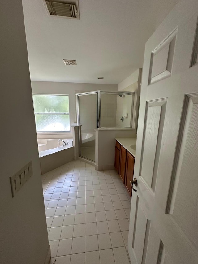 bathroom with vanity, separate shower and tub, and tile patterned flooring