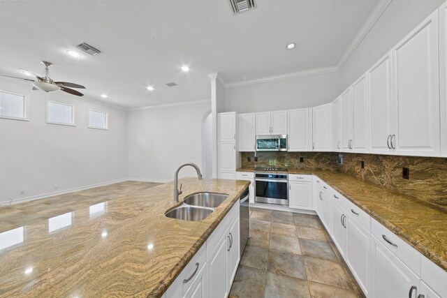 12520 NW 79th Mnr, Parkland, FL 33076 - kitchen with visible vents, a sink, decorative backsplash, and appliances with stainless steel finishes