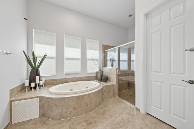 12520 NW 79th Mnr, Parkland, FL 33076 - full bath featuring visible vents, tile patterned flooring, a tub with jets, and a shower stall