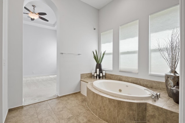 12520 NW 79th Mnr, Parkland, FL 33076 - bathroom featuring a whirlpool tub, baseboards, ceiling fan, and tile patterned flooring