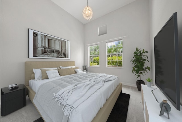 12520 NW 79th Mnr, Parkland, FL 33076 - bedroom featuring baseboards, a notable chandelier, a towering ceiling, and light colored carpet