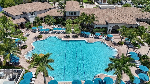 12520 NW 79th Mnr, Parkland, FL 33076 - community pool featuring a patio area