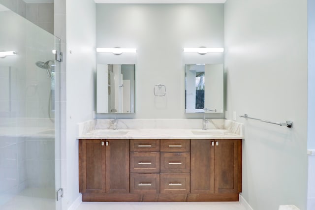 bathroom featuring vanity, walk in shower, and tile patterned floors