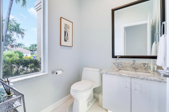 bathroom with tile patterned floors, toilet, and vanity