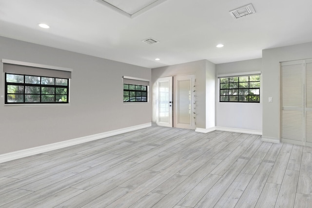 unfurnished room with light hardwood / wood-style flooring