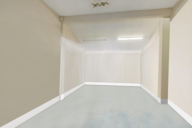 spare room with concrete floors