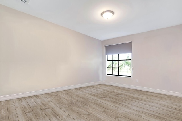 unfurnished room featuring light hardwood / wood-style flooring