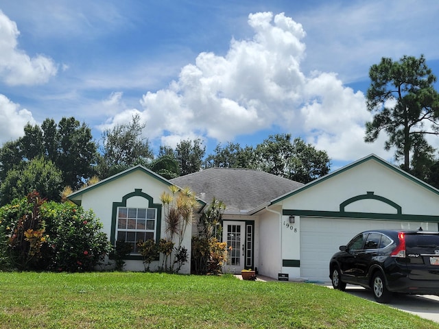 single story home featuring a garage and a front lawn