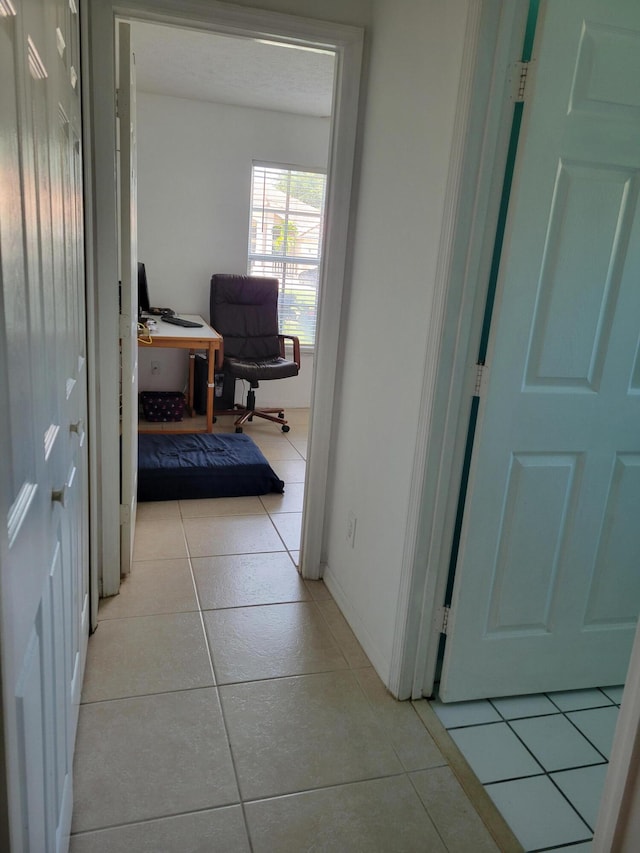 hallway with light tile patterned flooring