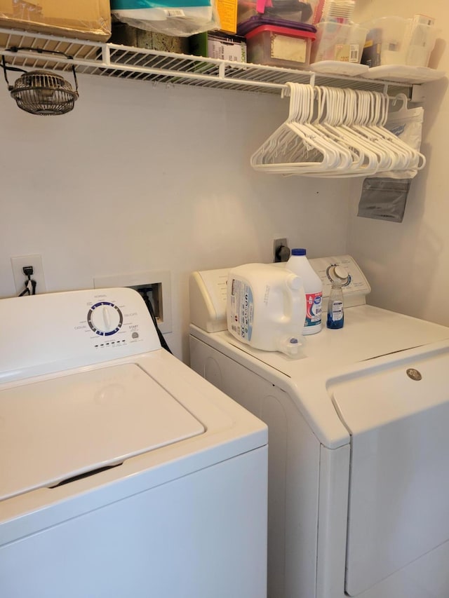 washroom with independent washer and dryer