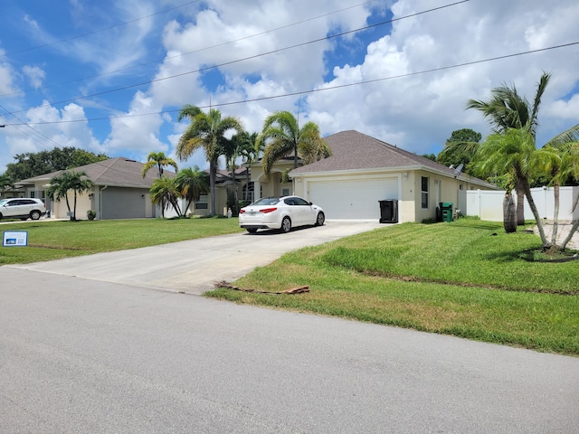 ranch-style home with a front lawn and a garage