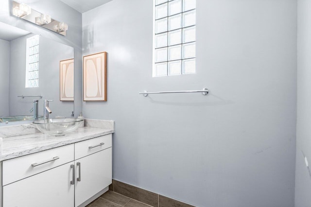 419 E Atlantic Ave, Delray Beach, FL 33483 - bathroom with tile patterned flooring, vanity, and baseboards