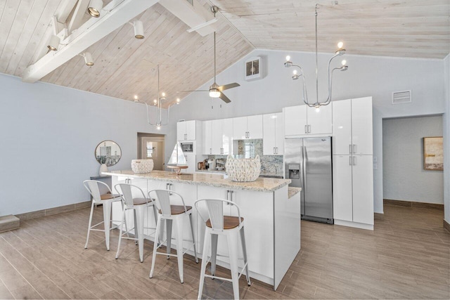 kitchen featuring stainless steel fridge, wood ceiling, high vaulted ceiling, ceiling fan, and white cabinets