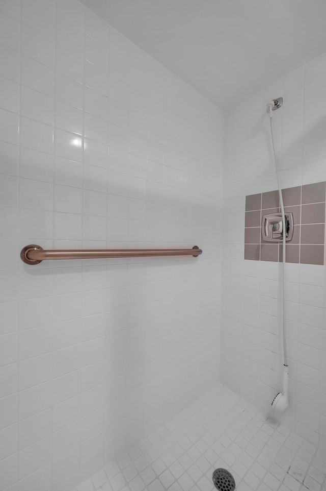 bathroom with a tile shower