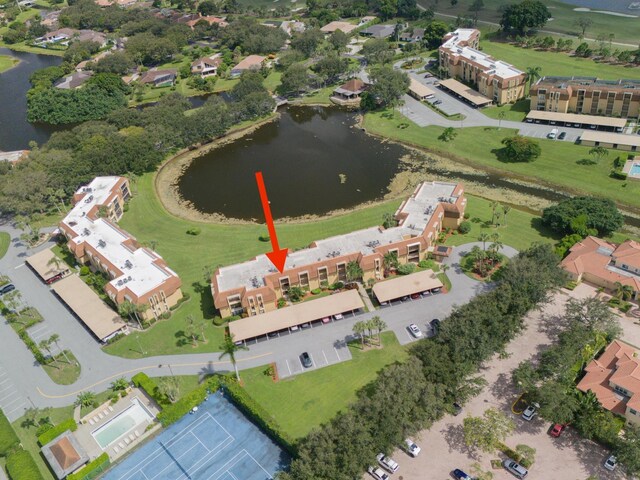 birds eye view of property with a water view