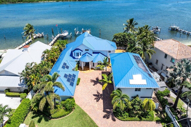 birds eye view of property with a water view