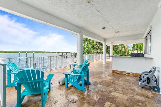 view of patio / terrace with a water view