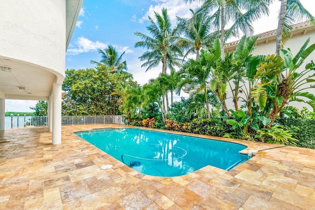 view of swimming pool with a patio area