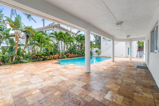 view of swimming pool featuring a patio