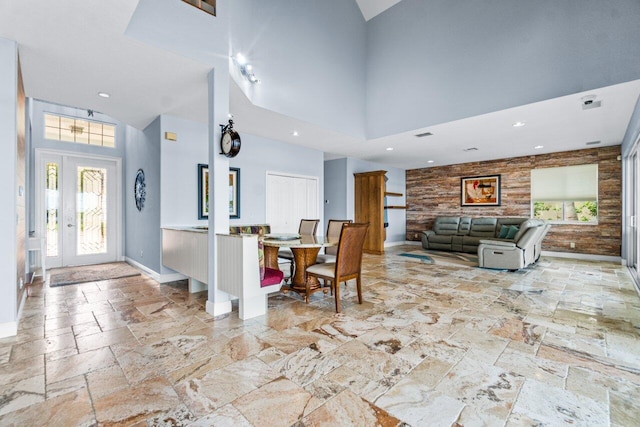 dining space with a high ceiling and plenty of natural light