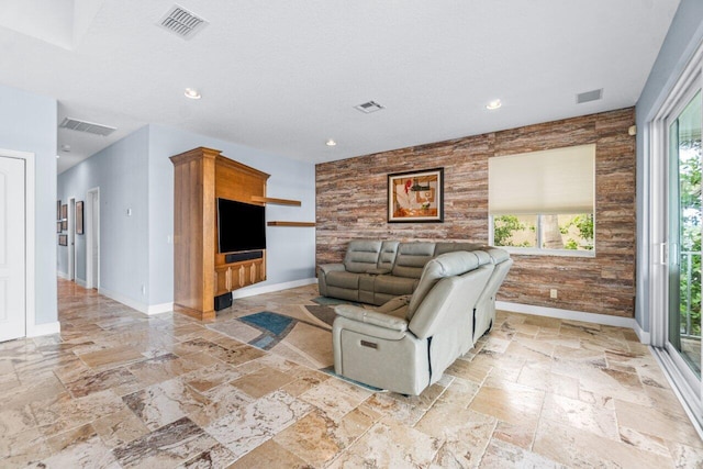 living room with wood walls