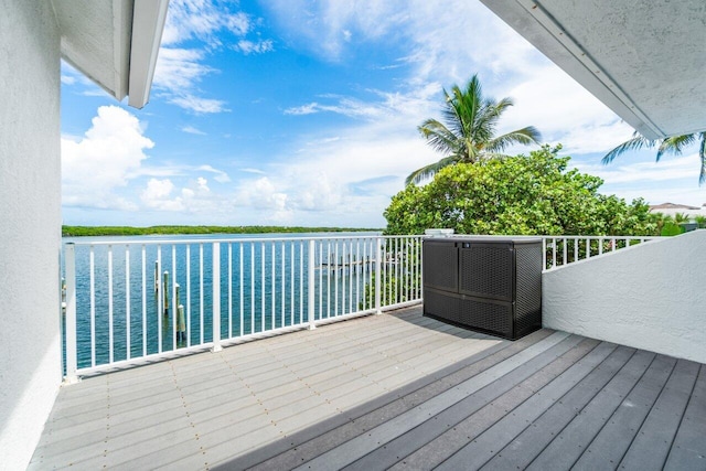 wooden terrace with a water view