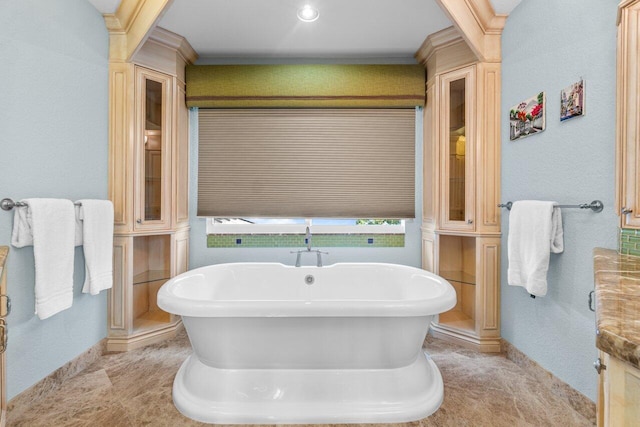 bathroom with a tub to relax in