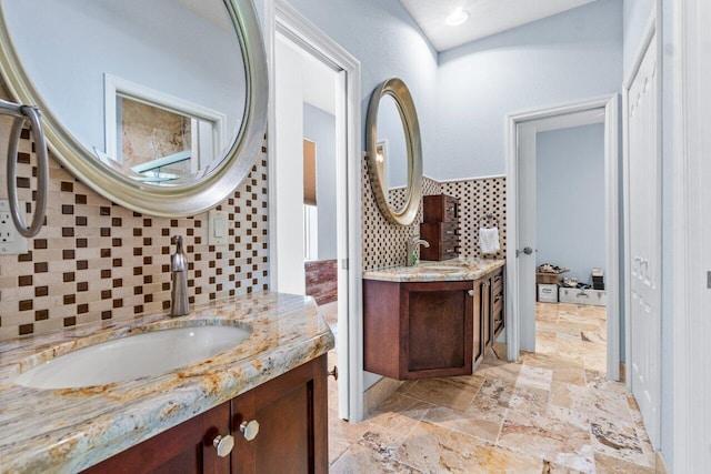 bathroom with backsplash and vanity