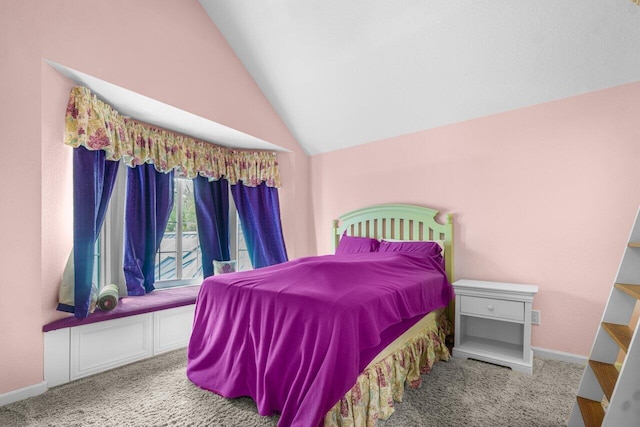 carpeted bedroom with vaulted ceiling