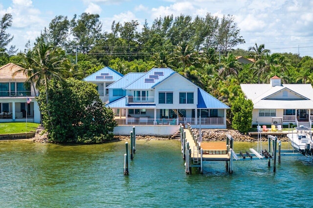 rear view of house with a water view