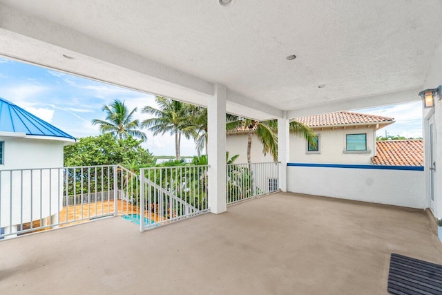 view of patio featuring a balcony