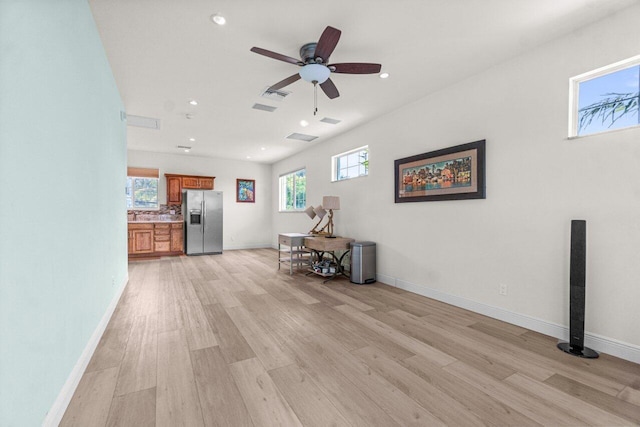 interior space with light hardwood / wood-style flooring and ceiling fan