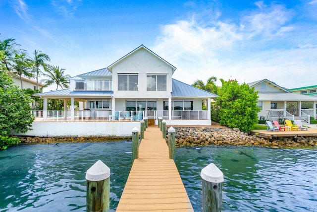 rear view of house with a water view