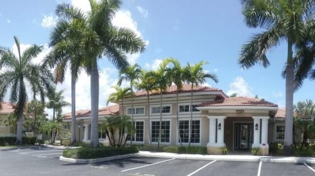 view of property with uncovered parking