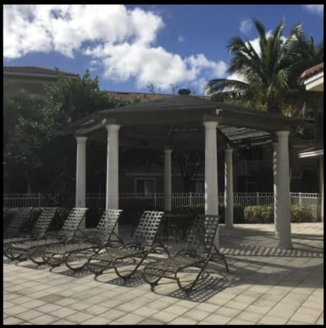 view of patio / terrace featuring fence