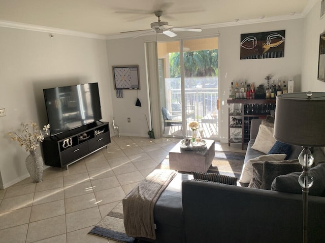 tiled living area featuring ceiling fan, baseboards, and ornamental molding