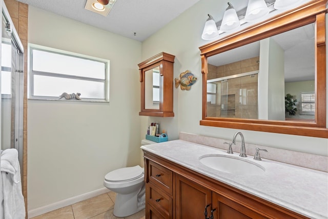 bathroom featuring tile patterned floors, walk in shower, toilet, vanity, and a textured ceiling