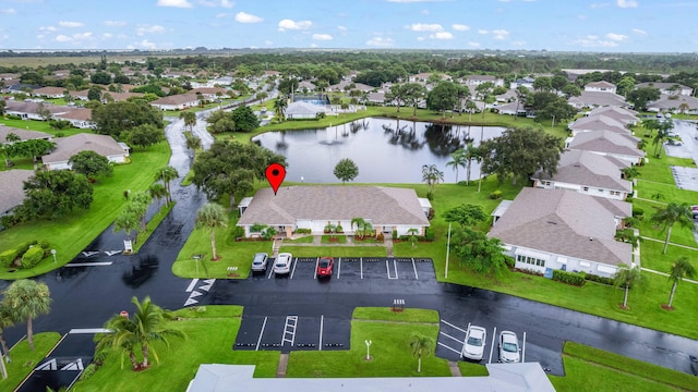 bird's eye view featuring a water view and a residential view