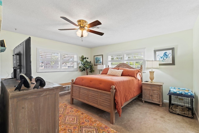 411 Sandpiper Dr Unit A, Fort Pierce, FL 34950 - bedroom featuring ceiling fan, a textured ceiling, and light colored carpet