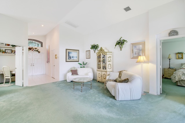 sitting room featuring light carpet