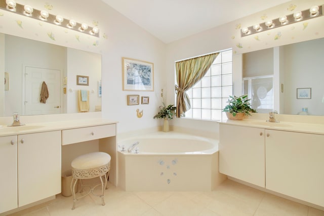 bathroom with vanity, vaulted ceiling, separate shower and tub, and tile patterned floors