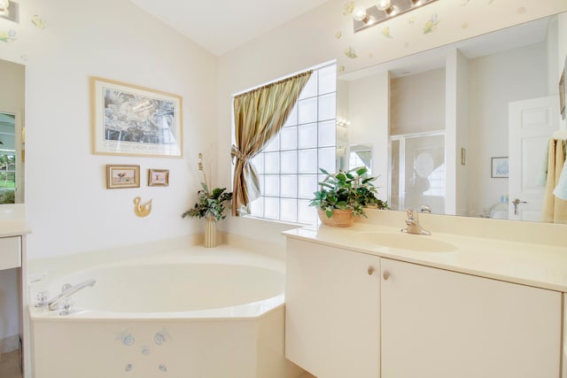 bathroom featuring vanity and shower with separate bathtub