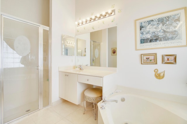 bathroom featuring tile patterned floors, separate shower and tub, and vanity