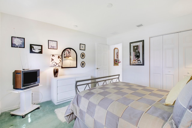 bedroom with a closet and carpet