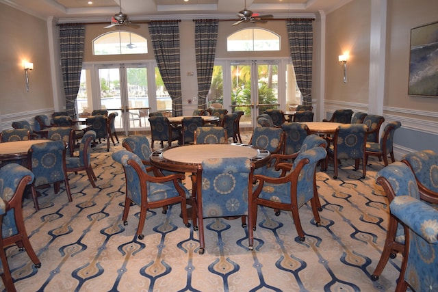 dining room featuring ceiling fan, plenty of natural light, and french doors