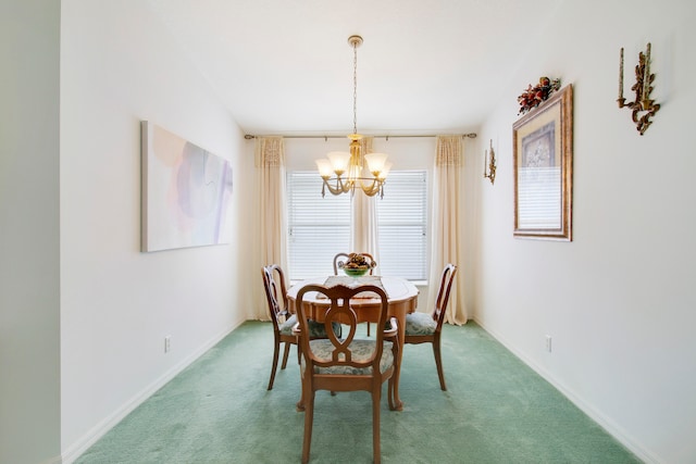 carpeted dining space featuring a chandelier