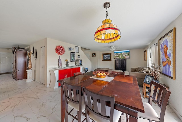 dining room with ceiling fan and light tile patterned flooring