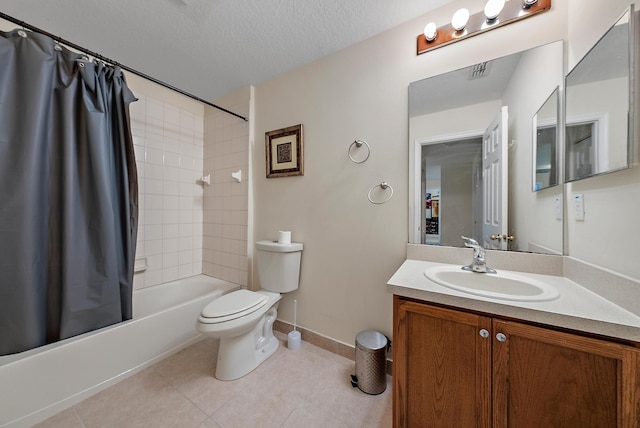 full bathroom with tile patterned floors, toilet, shower / bath combination with curtain, vanity, and a textured ceiling