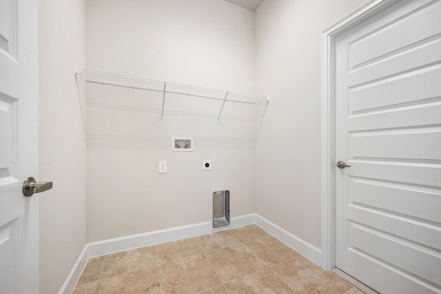 washroom with hookup for an electric dryer, hookup for a washing machine, and light tile patterned flooring