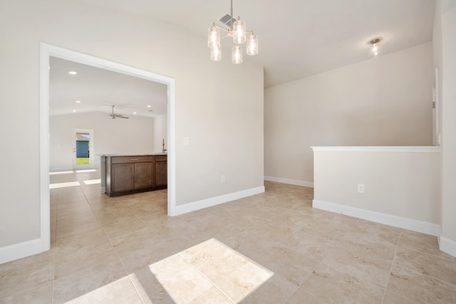 empty room with light tile patterned floors, ceiling fan with notable chandelier, and vaulted ceiling